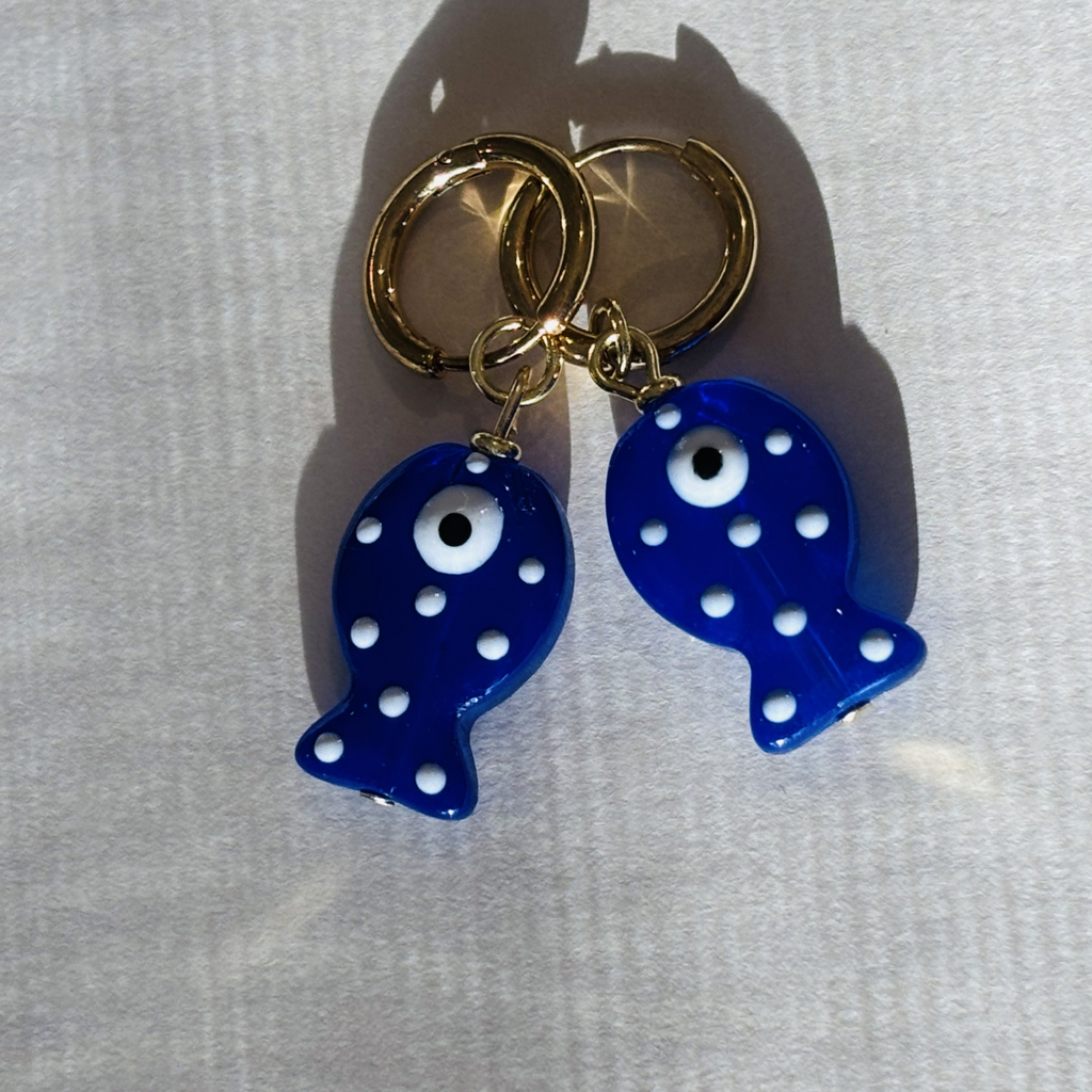 Blue fish-shaped earrings with white polka dots 