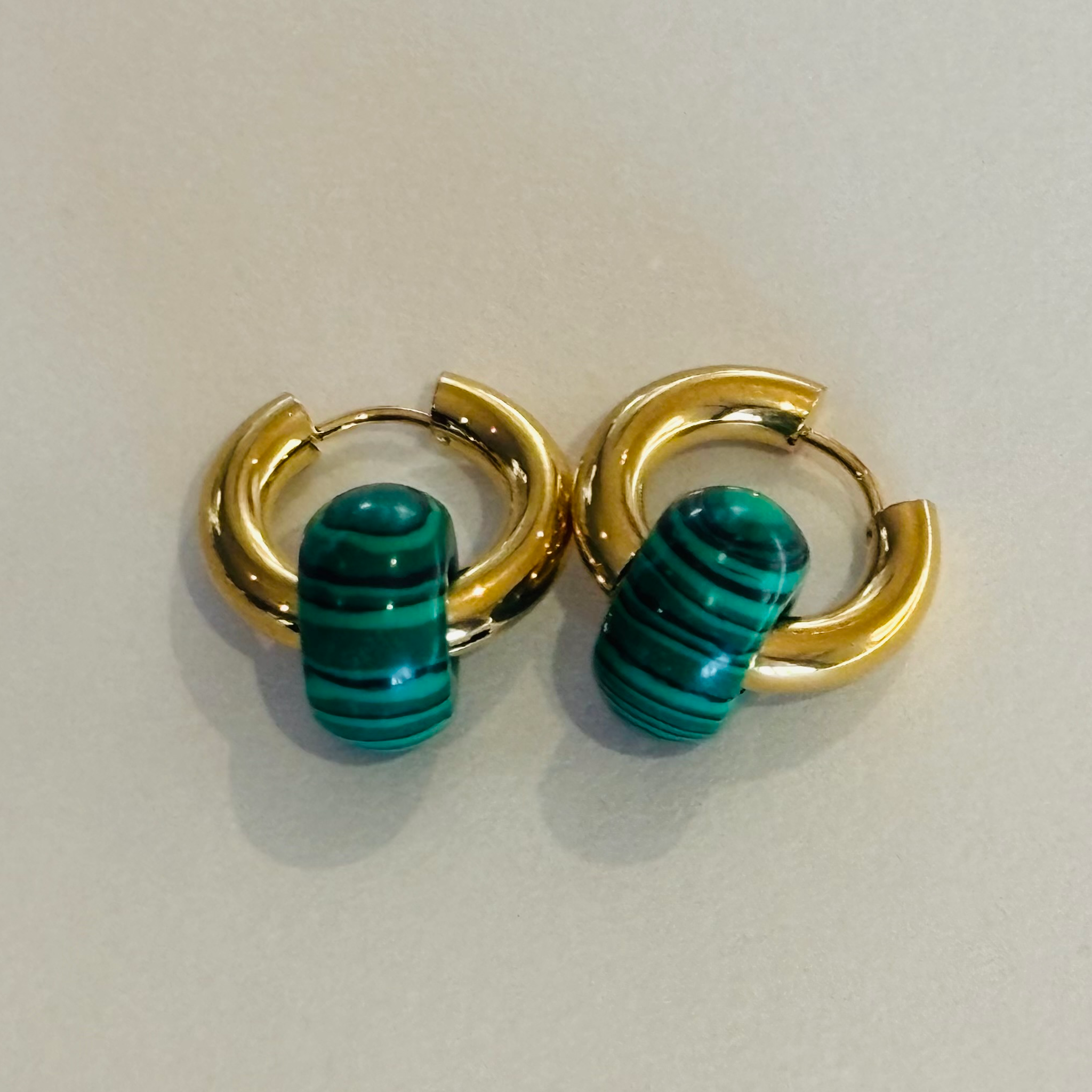 Gold hoop earrings with green beads
