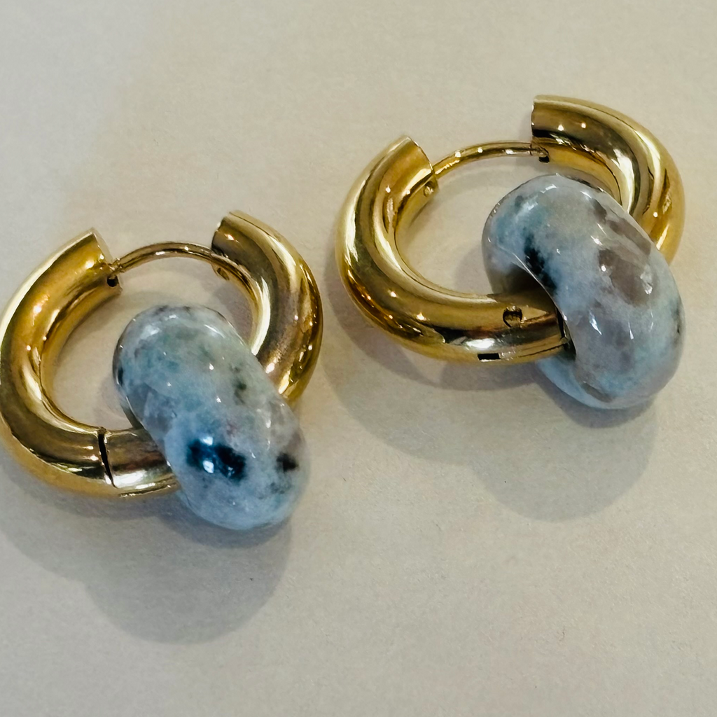 Pair of gold hoop earrings with gemstones