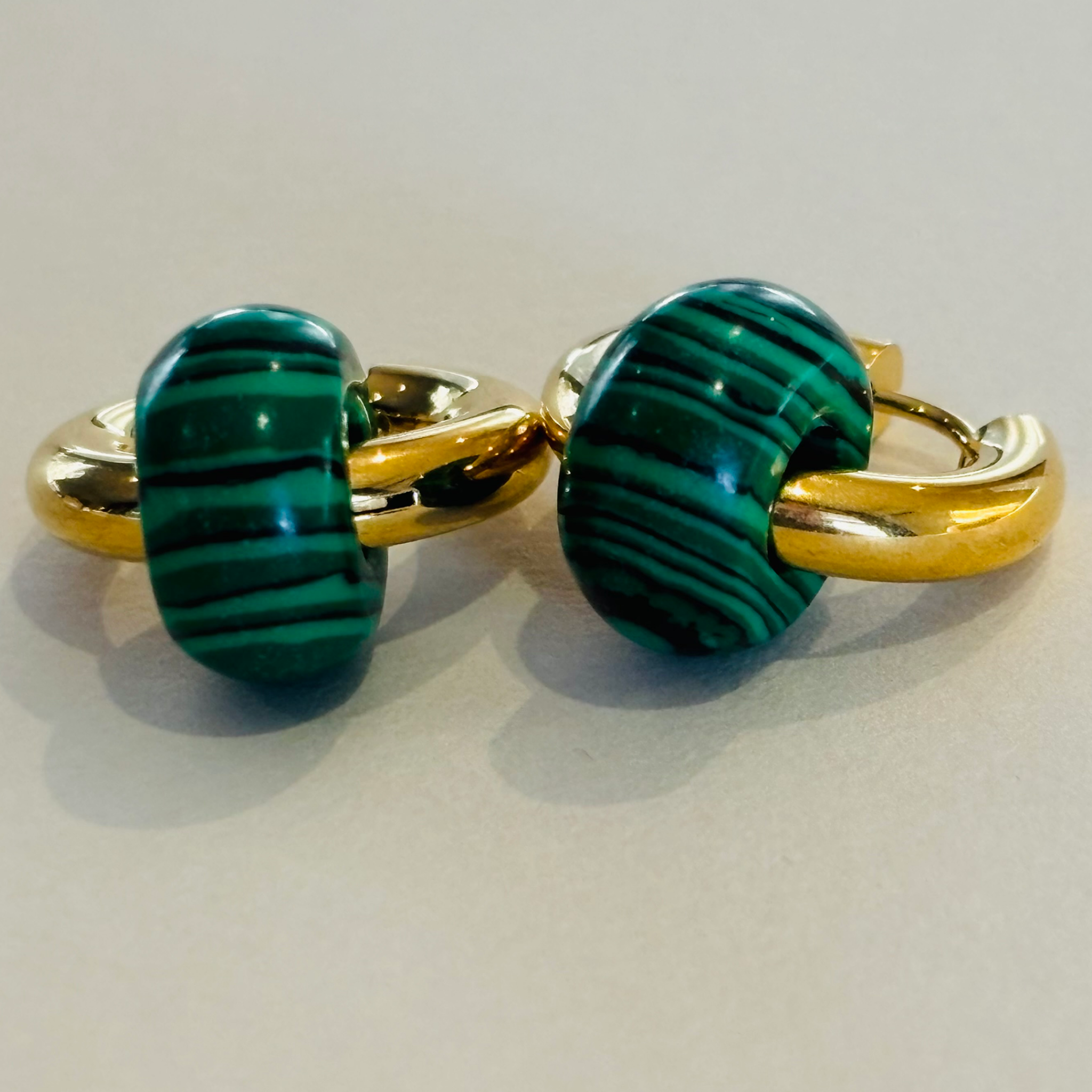 Pair of gold and green earrings