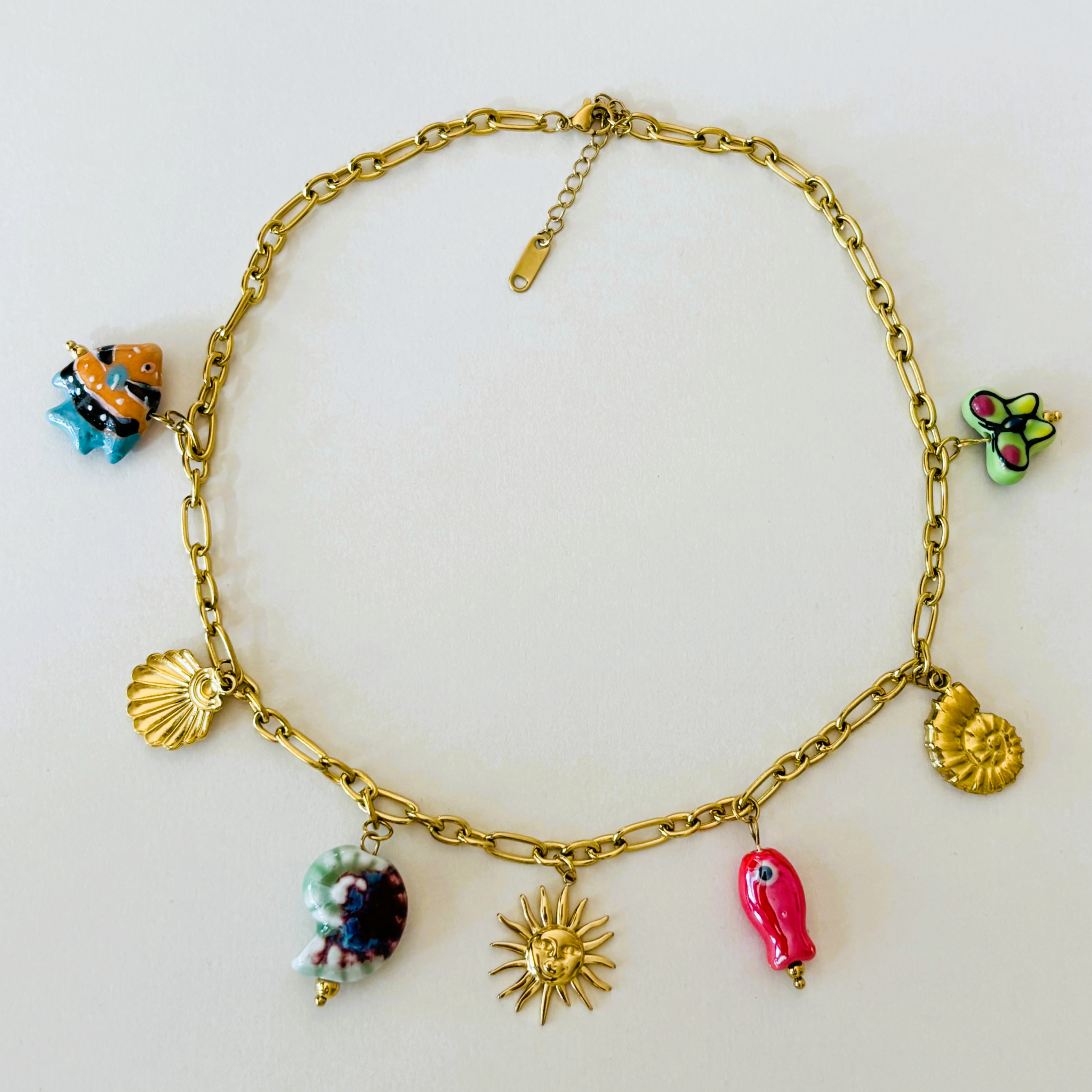 Gold bracelet with colorful charms