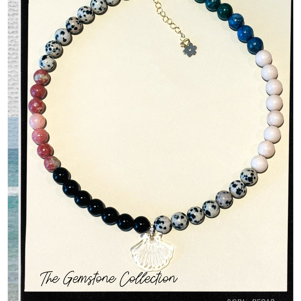 Beaded necklace with various colored beads and a shell charm