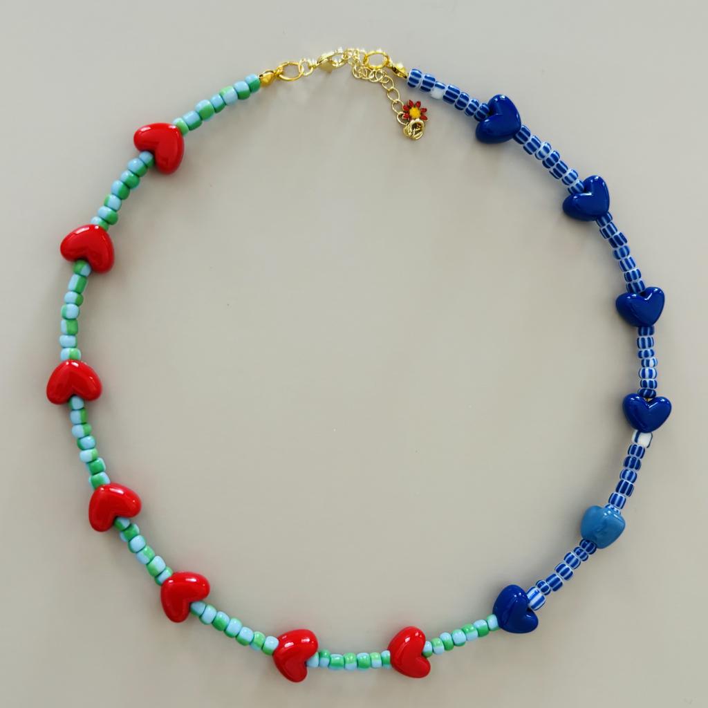 Colorful beaded necklace with red, blue, and green heart-shaped beads