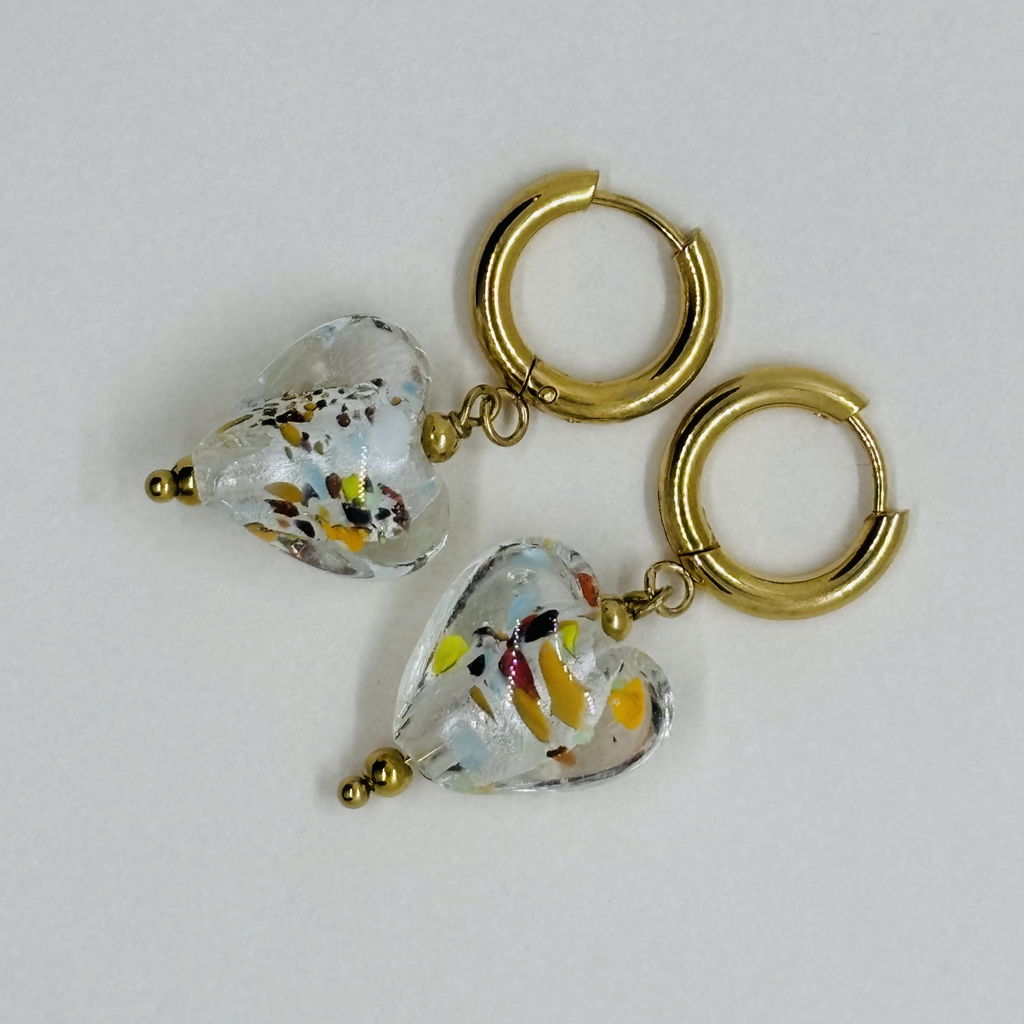 Handcrafted gold hoop earrings with heart-shaped glass charms