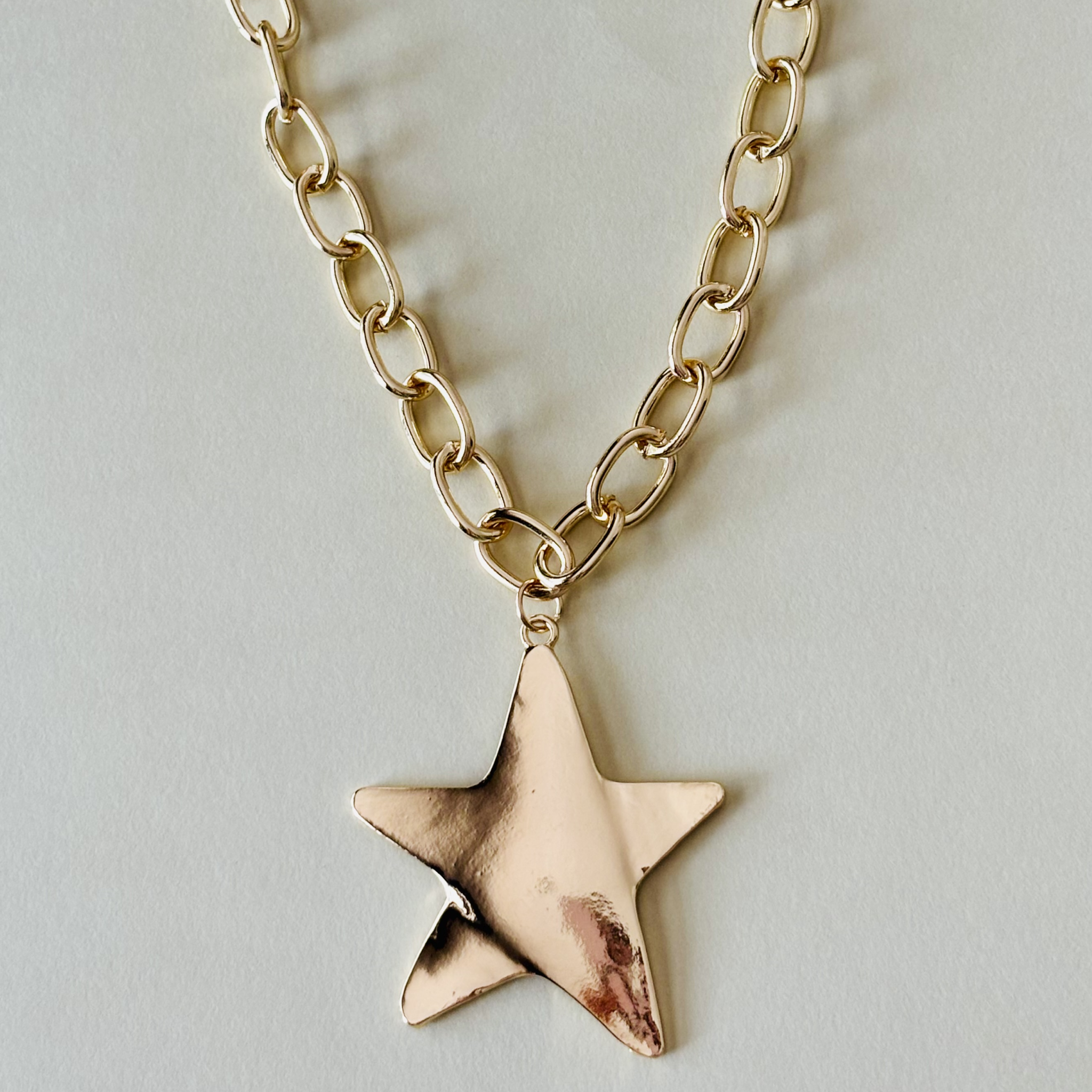 Gold star pendant necklace