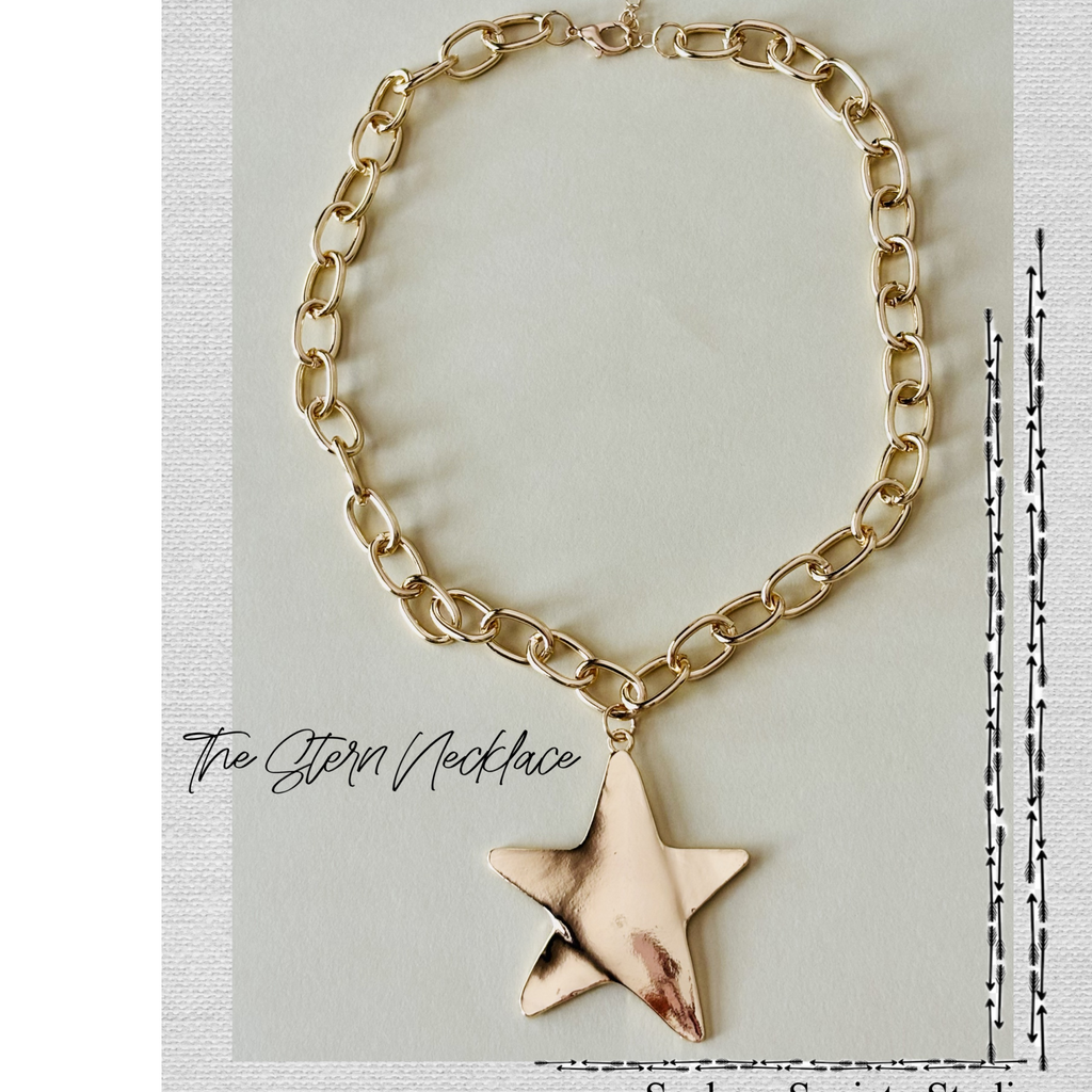 Gold chain necklace with a star-shaped pendant