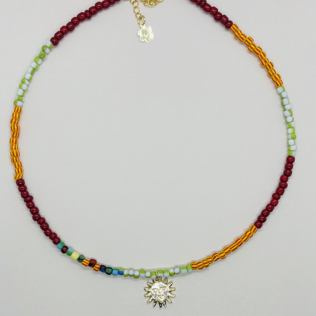 Necklace with colorful beads and a sunflower charm