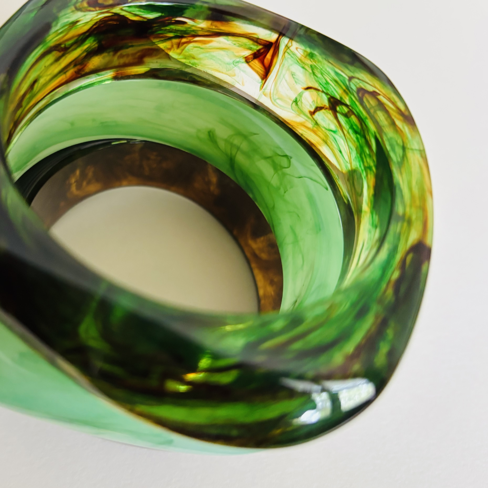 Three green and black handcrafted marbled bangles