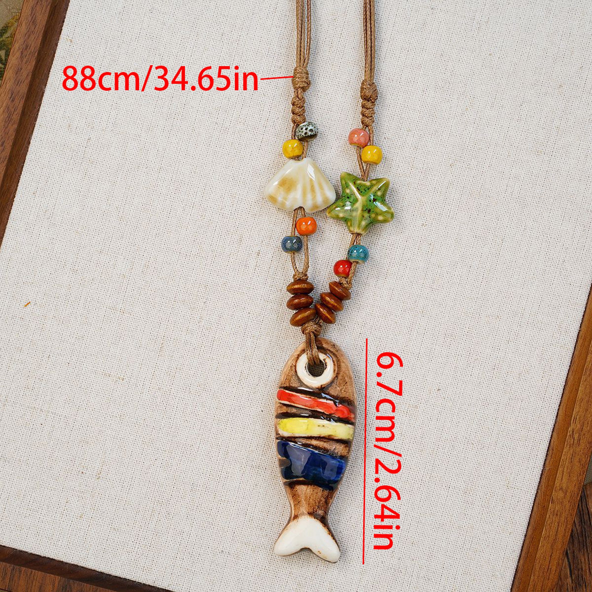 Colorful fish-shaped pendant with beads on a cord necklace