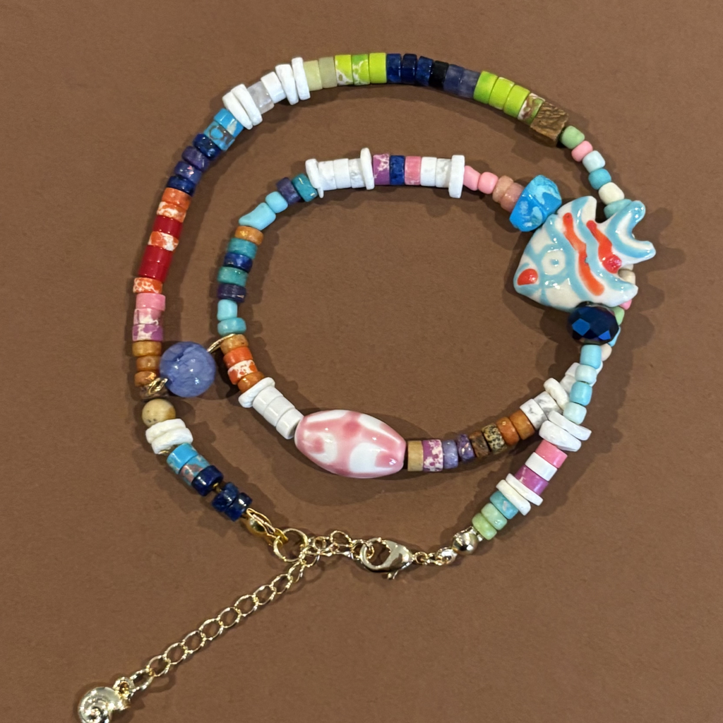 Colorful beaded necklace with a fish charm