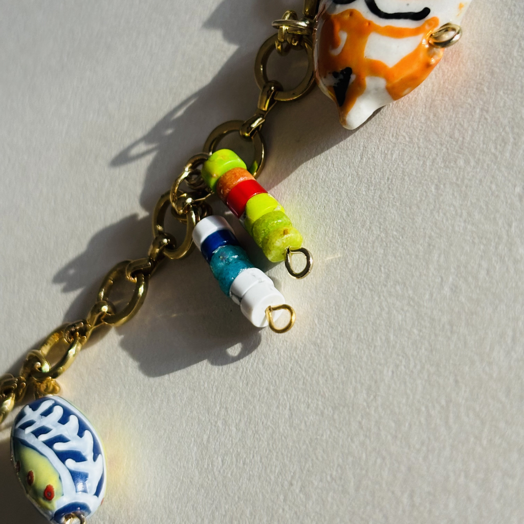 Colorful beaded keychain with decorative elements 