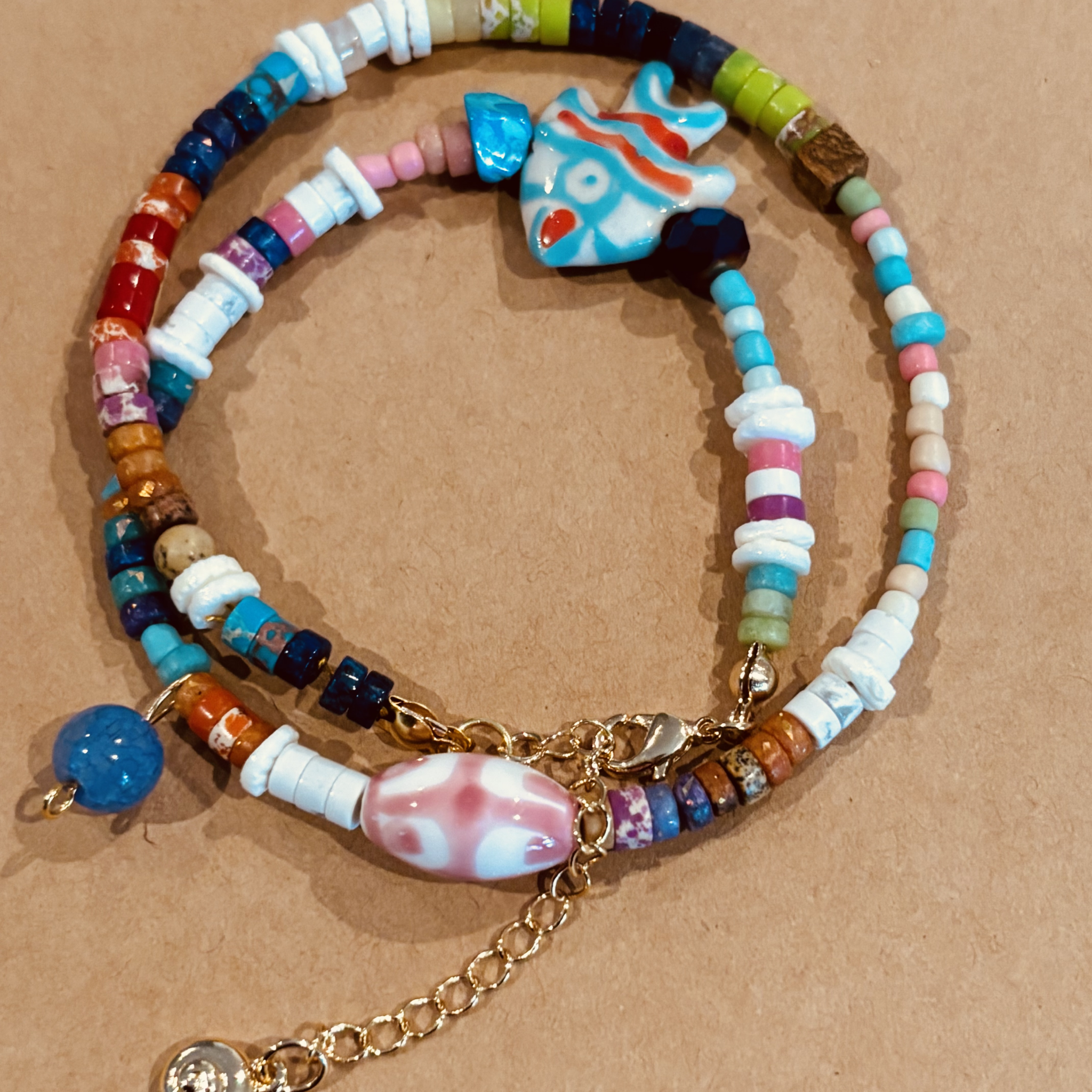 Colorful beaded bracelet with fish charm