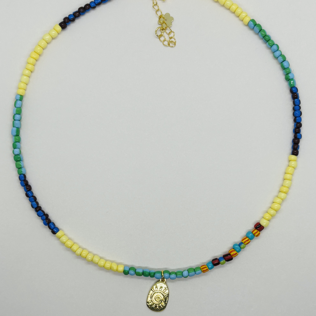 Colorful handcrafted beaded necklace with a gold pendant