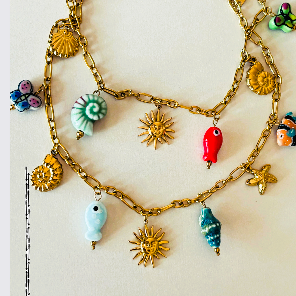 Gold chain bracelet with colorful charms