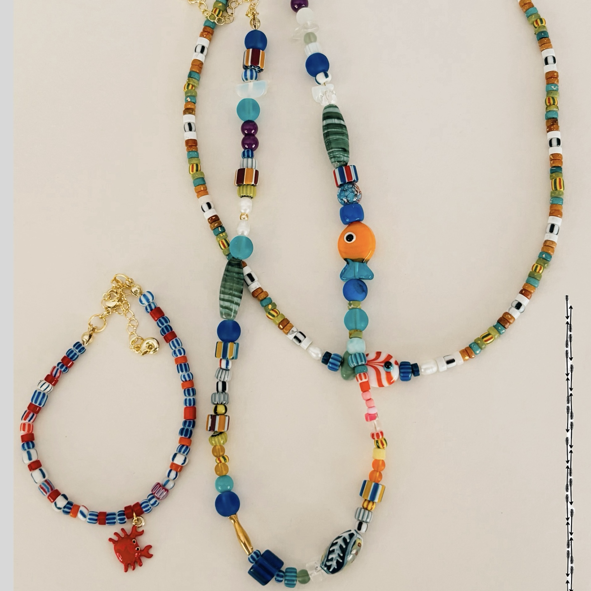 Three handcrafted colourful beaded neckalces